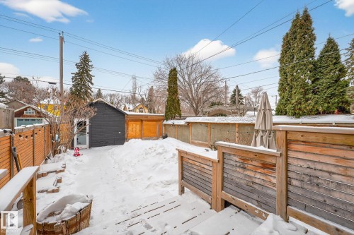 Wooden deck with a fenced backyard and an outbuilding - 10523 127 Street, Edmonton, AB - Outdoor