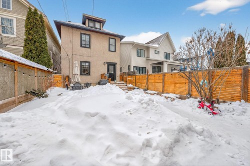 Snow covered back of property with a fenced backyard - 10523 127 Street, Edmonton, AB - Outdoor