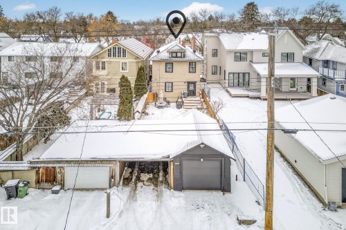 View of front facade featuring a residential view and an outdoor structure - 10523 127 Street, Edmonton, AB - Outdoor With Facade