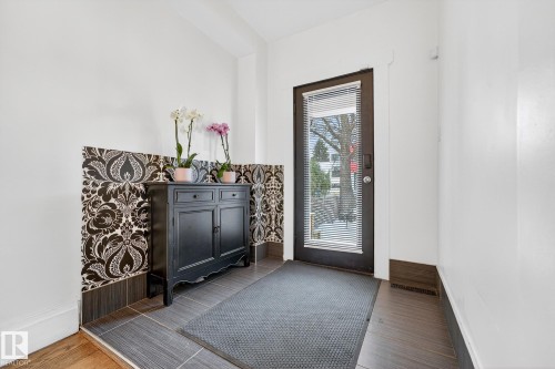 Entryway featuring dark wood-style floors and baseboards - 10523 127 Street, Edmonton, AB - Indoor Photo Showing Other Room