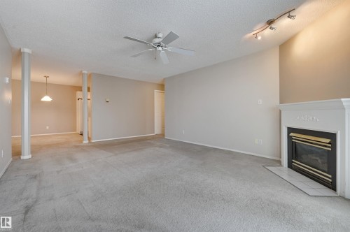 303 8811 106A Avenue, Edmonton, AB - Indoor With Fireplace