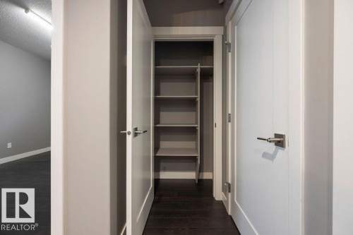 Corridor featuring dark wood-type flooring and baseboards - 7515 178 Avenue, Edmonton, AB - Indoor Photo Showing Other Room