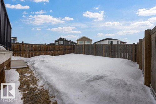 Snowy yard with a fenced backyard - 7515 178 Avenue, Edmonton, AB - Outdoor