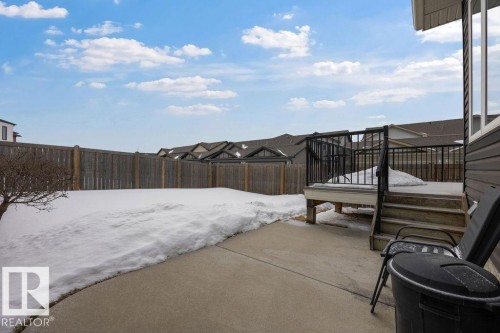 Snow covered patio featuring a fenced backyard and a patio - 7515 178 Avenue, Edmonton, AB - Outdoor