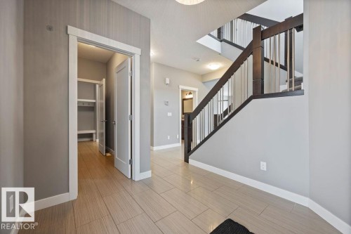 Entrance foyer with stairs and wood finish floors - 7515 178 Avenue, Edmonton, AB - Indoor Photo Showing Other Room