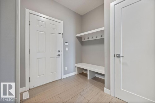 Mudroom with baseboards and wood tiled floors - 7515 178 Avenue, Edmonton, AB - Indoor Photo Showing Other Room