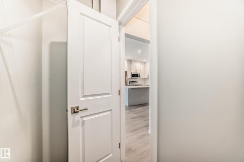 Hallway featuring light wood-style floors - 3323 Roy Brown Way, Edmonton, AB - Indoor Photo Showing Other Room