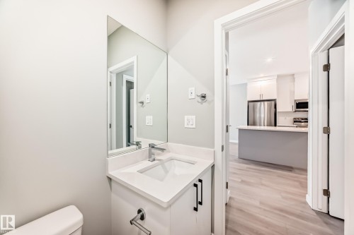 Bathroom with vanity, light wood-type flooring, and recessed lighting - 3323 Roy Brown Way, Edmonton, AB - Indoor Photo Showing Bathroom