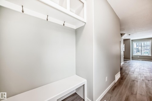 Mudroom featuring wood finished floors and baseboards - 3323 Roy Brown Way, Edmonton, AB - Indoor Photo Showing Other Room