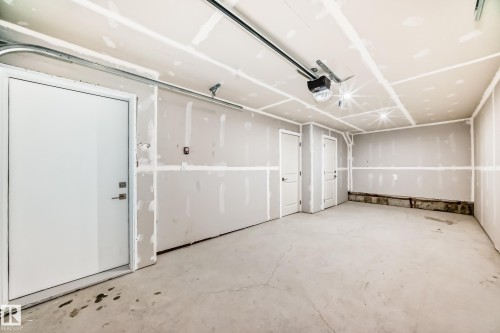 Garage with a garage door opener - 3323 Roy Brown Way, Edmonton, AB - Indoor Photo Showing Garage