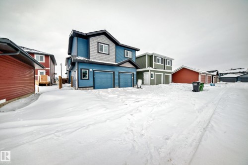 View of front facade with a garage - 3323 Roy Brown Way, Edmonton, AB - Outdoor