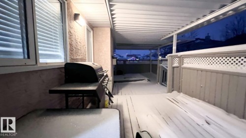View of patio / terrace with a deck and a grill - 6731 162 Ave, Edmonton, AB - 