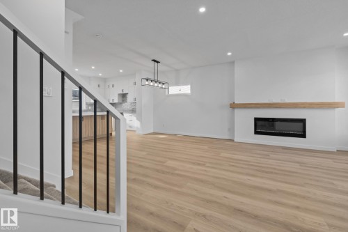 54 Eden Link, Fort Saskatchewan, AB - Indoor Photo Showing Other Room With Fireplace