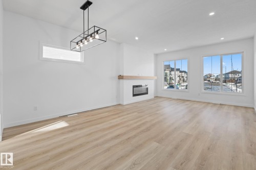 54 Eden Link, Fort Saskatchewan, AB - Indoor Photo Showing Living Room With Fireplace