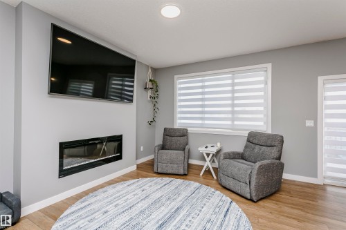 354 Genesis Villa(S), Stony Plain, AB - Indoor Photo Showing Living Room With Fireplace