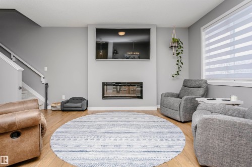 354 Genesis Villa(S), Stony Plain, AB - Indoor Photo Showing Living Room With Fireplace