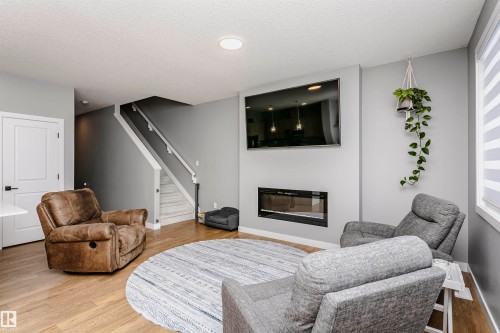 354 Genesis Villa(S), Stony Plain, AB - Indoor Photo Showing Living Room With Fireplace
