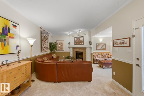 324 Wolf Ridge Point(E), Edmonton, AB - Indoor Photo Showing Living Room With Fireplace