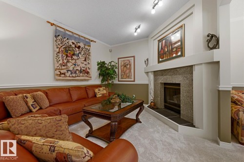 324 Wolf Ridge Point(E), Edmonton, AB - Indoor Photo Showing Living Room With Fireplace
