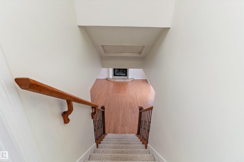 Stairs with attic access and wood finished floors - 115 Walker Road, Edmonton, AB - Indoor