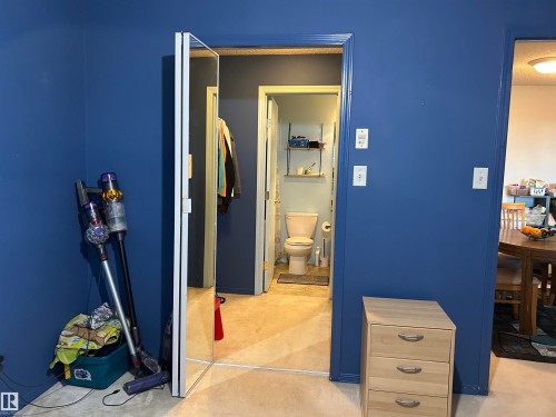 Bedroom with light carpet - 310 2430 Guardian Road, Edmonton, AB - Indoor