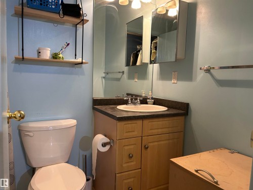 Bathroom with vanity and toilet - 310 2430 Guardian Road, Edmonton, AB - Indoor Photo Showing Bathroom