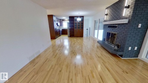 6426 37B Avenue, Edmonton, AB - Indoor Photo Showing Other Room With Fireplace