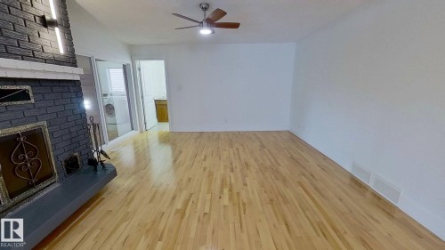 6426 37B Avenue, Edmonton, AB - Indoor Photo Showing Other Room With Fireplace