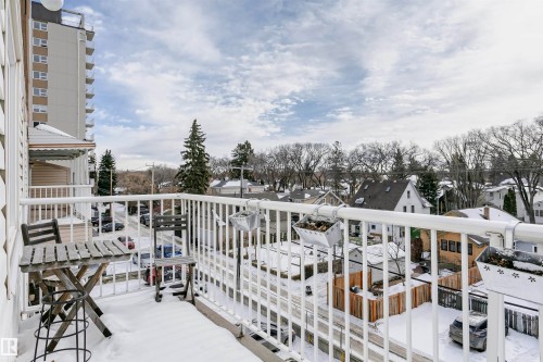 Snow covered back of property with a residential view - 407 8149 111 St S, Edmonton, AB - Outdoor With Balcony