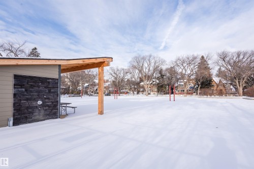 Yard covered in snow with a residential view - 407 8149 111 St S, Edmonton, AB - Outdoor