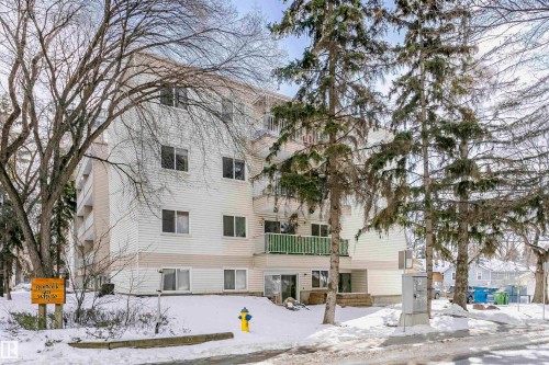 Snow covered building featuring a view of apartment building / complex - 407 8149 111 St S, Edmonton, AB - Outdoor With Facade