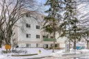 Snow covered building featuring a view of apartment building / complex - 407 8149 111 St S, Edmonton, AB  - Outdoor With Facade 