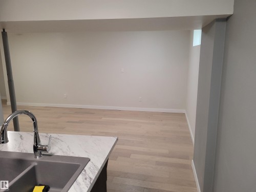 Kitchen with Raised Eating Bar - looking into Living Room - 10832 163 Street, Edmonton, AB - Indoor