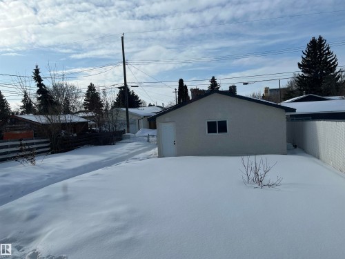 View of snowy exterior with stucco siding - 10832 163 Street, Edmonton, AB - Outdoor