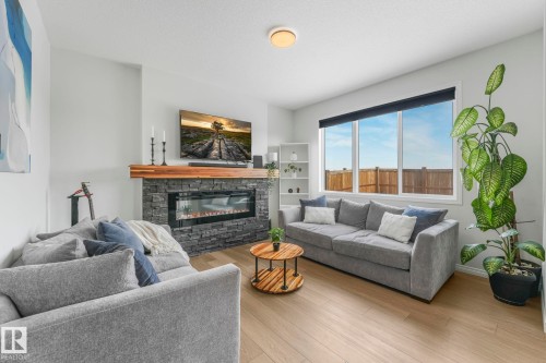 6417 66 Street, Beaumont, AB - Indoor Photo Showing Living Room With Fireplace