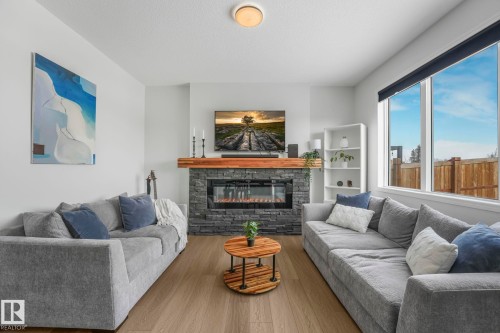 6417 66 Street, Beaumont, AB - Indoor Photo Showing Living Room With Fireplace