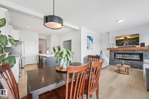 6417 66 Street, Beaumont, AB - Indoor Photo Showing Dining Room With Fireplace