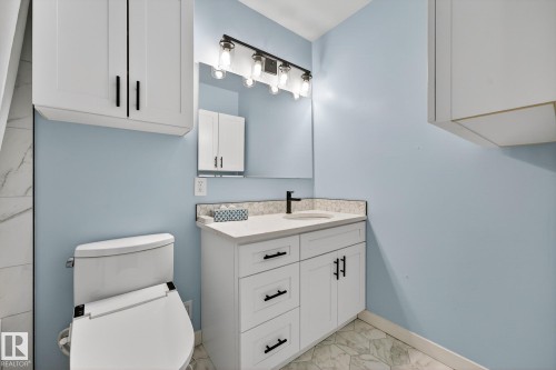 Bathroom with vanity and light marble finish flooring - 21 Marchand Place, St. Albert, AB - Indoor Photo Showing Bathroom