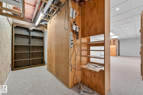 Unfinished basement with light carpet, a drop ceiling, and recessed lighting - 21 Marchand Place, St. Albert, AB - Indoor