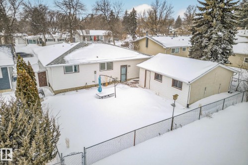 Snow covered back of property featuring a residential view - 21 Marchand Place, St. Albert, AB - Outdoor