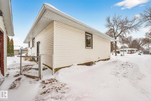 View of snow covered exterior with a gate - 21 Marchand Place, St. Albert, AB - Outdoor