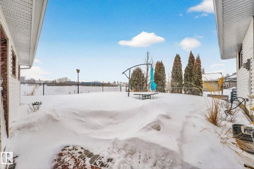 View of yard layered in snow - 21 Marchand Place, St. Albert, AB - Outdoor