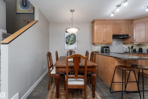 Dining room with baseboards and dark stone finish floors - 10906 72 Avenue, Edmonton, AB - Indoor