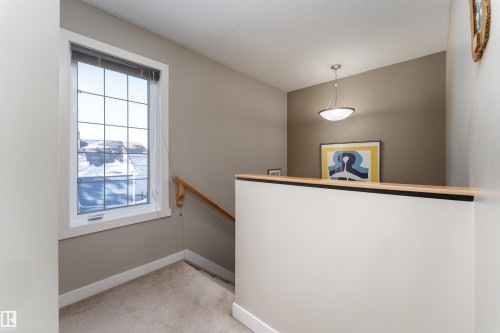 Staircase featuring baseboards and carpet floors - 10906 72 Avenue, Edmonton, AB - Indoor Photo Showing Other Room