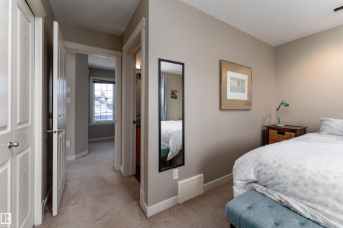 Bedroom featuring baseboards and light colored carpet - 10906 72 Avenue, Edmonton, AB - Indoor Photo Showing Bedroom