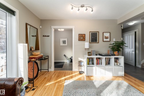 Hallway with light wood-style flooring - 10906 72 Avenue, Edmonton, AB - Indoor