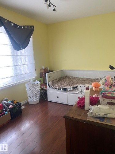 Bedroom with dark wood-style floors - 10945 54 Avenue, Edmonton, AB - Indoor Photo Showing Bedroom
