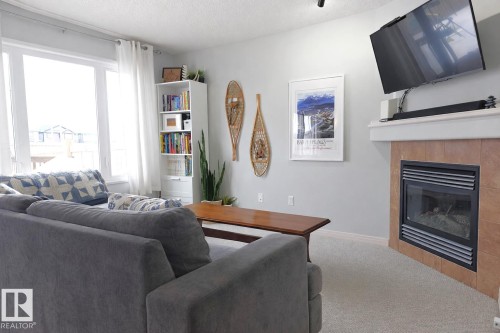 2151 28 Street, Edmonton, AB - Indoor Photo Showing Living Room With Fireplace