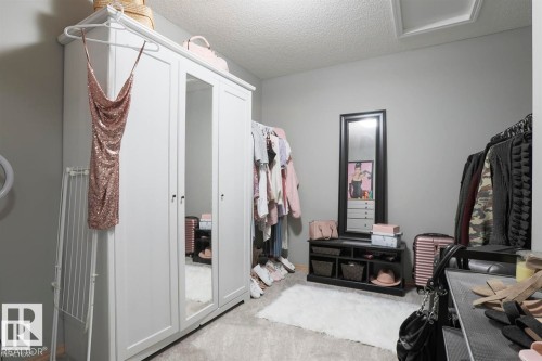 Walk in closet featuring light colored carpet - 86 604 62 Street, Edmonton, AB - Indoor