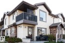 Back of property featuring a balcony, stone siding, and a patio area - 86 604 62 Street, Edmonton, AB  - Outdoor 